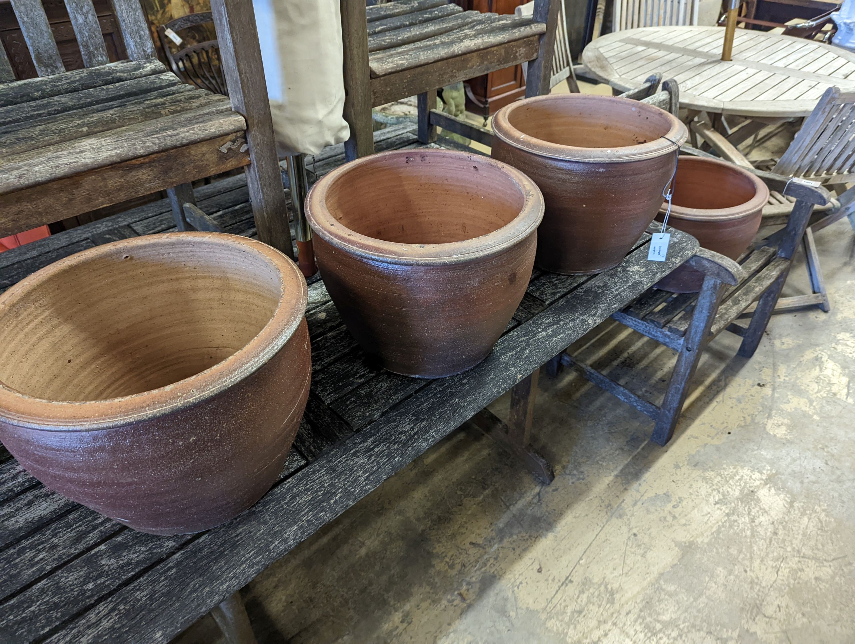 Four circular glazed earthenware garden planters, diameter 40cm, height 31cm